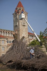 The temporary wood sculpture "The Bedazzler," at the corner of 14th and Jayhawk Boulevard since 2009, was taken down Friday, August 19, 2011. The removal Friday was not related to storms that hit the area overnight but was because the tree supporting the sculpture was dying. Parts of the sculpture will be recycled and used in other ways across campus.