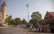 The temporary wood sculpture "The Bedazzler" at the corner of 14th and Jayhawk Boulevard since 2009, was taken down Friday, August 19, 2011. Parts of the sculpture will be recycled and used in other ways across campus.