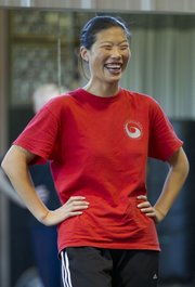 Chen Huixian stops for a moment to share a laugh with her class during a beginner tai chi class held at Premier Martial Arts Academy, 3201 Clinton Parkway. The classes, which began in May, are held twice a month, generally every other Sunday.