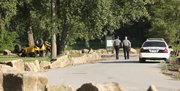 Lawrence police officers investigate a fatality accident Saturday at Riverfront Park. Police say one person died when a Jeep overturned early Saturday near the park entrance.