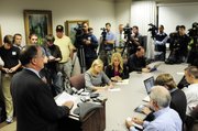 University of Missouri Chancellor Brady Deaton, left, addresses the media regarding Missouri and the future of the Big 12 Conference on Thursday at Jesse Hall on the MU campus in Columbia, Mo.