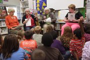 The Lawrence Vintage Players from left, Terry Smith, Mary Ann Saunders, Pat Guy and Jane Robshaw, took time to read "Rumpelstiltskin" to some 2nd graders at Corley Elementary School.