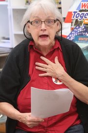 Reading "Rumpelstiltskin" to a second-grade class at Cordley School, Lawrence Vintage Player, Mary Ann Saunders talks for spinning gold from straw.