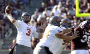 Oklahoma State quarterback Brandon Weeden (3) throws a pass against Texas A&M, Saturday, Sept. 24, 2011, in College Station, Texas. Weeden threw for a school-record 438 yards and two scores in their 30-29.