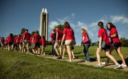 Incoming Kansas University freshmen make their way toward the Campanile during the 14th-annual “Walk Up the Hill” Monday, Aug. 16, 2010.