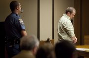 Zachary Harrison waits to be led away Friday by a Douglas County Sheriff’s officer after his sentencing in the Nov. 23, 2010, drunken-driving crash that killed Cameron Freeman. Harrison received more than six years in prison.