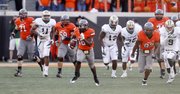 Oklahoma State running back Herschel Sims (18) takes off on for an 81-yard touchdown run against Baylor during the fourth quarter in Stillwater, Okla., Saturday, Oct. 29, 2011. Oklahoma State won 59-24.