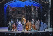 Snow falls on the cast members of the Broadway-style musical, A Dickens' Christmas Carol, at Silver Dollar City.