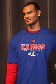 Perry Ellis officially signed a letter of intent with Kansas at Wichita Heights High School on Wednesday.