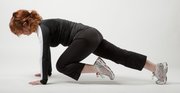Plank tuck: Lift leg several inches, toes pointed, and bring knee toward your left elbow, rounding your back slightly.