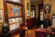 owner Terry Riordan talks about the Tiffany stained glass windows and ornate fireplaces in the Ludington-Thacher House at 1613 Tenn.