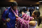 Kansas forward Thomas Robinson receives a lei as a welcoming gesture upon the Jayhawks' arrival at the Kahului Airport on Friday, Nov. 18, 2011 in Maui.