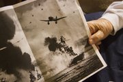 Dorwin Lamkin has a photo copy that shows Japanese planes attacking the USS Nevada, lower right, which he was on at Pearl Harbor.