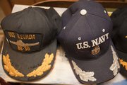 Dorwin Lamkin has a selection of caps he keeps by his door ready to wear. Lamkin is one of a handful of Kansas survivors from the attack on Pearl Harbor. He was on the USS Nevada.