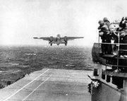 In this April 18, 1942 file photo, one of Lt. Col. Jimmy Doolittle's B-25 bombers takes off from the flight deck of the USS Hornet for the initial air raid on Tokyo. Coming just four months after the Imperial Japanese Navy savaged the U.S. Pacific Fleet at Pearl Harbor, the Doolittle raid on Japan's home did little damage, but lifted the spirits of Americans and electrified a world at war. (AP Photo, File)