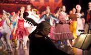 In this file photo, Kate Dinneen, Lawrence, plays a bass with the pit orchestra before the finale of dancers performing in A Kansas Nutcracker during a dress rehearsal on Wednesday, Dec. 7, 2011 in the theater at the Lawrence Arts Center. The Kansas Nutrcracker, written by Ric Averill, is a reinterpretation of E.T.A. Hoffman's The Nutcracker and the Mouse King, and is set in the Civil War era, rather, centering on Kansas history.