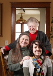 Debra Jennings, middle, a professional braider, is pictured with her mother, Lorene Davison and her daughter, Cody Jennings on Monday, Dec. 12, 2011. Jennings learned to braid from her mother and now works with her daughter braiding hair at Renaissance festivals, parties and weddings.