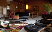 The living room of Tom Harper and Terri Erickson-Harper’s Lawrence home is a classic example of midcentury modern style.