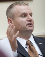 SRS Secretary Rob Siedlecki spoke with Lawrence Journal-World editors and reporters in this file photo from Monday, July 11, 2011. Siedlecki will be returning to Florida to take a state government position there and be closer to his family, Gov. Sam Brownback's office said Thursday.