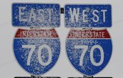 Snow sticks to road signs along I-70 near Paxico, Kan., Tuesday, Dec. 20, 2011. A deadly storm that halted travel throughout the Great Plains weakened Tuesday and officials reopened Interstate 40 in the Texas Panhandle and New Mexico, and portions of Interstate 70 in western Kansas that had been closed in both directions.