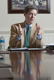 Gov. Sam Brownback, pictured in January 2012, speaking to reporters and editors at the Lawrence Journal-World.