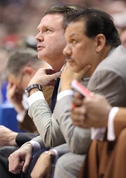 Kansas head coach Bill Self adjusts his tie as he watches from the bench next to assistant Kurtis Townsend during the second half on Saturday, Dec. 31, 2011 at Allen Fieldhouse.