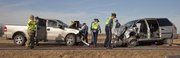 Kansas Highway Patrol troopers investigate the scene of an accident that sent two people to the hospital Tuesday, Jan. 3, 2012 on Kansas Highway 56.
