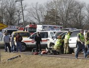 Lawrence-Douglas County Fire Medical workers and law enforcement officers respond to a head-on crash Tuesday, Jan. 3, 2011 on U.S. Highway 56, west of Worden.