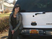 Pamela Barker of Minneapolis is the owner of the coveted "JAYHAWK" license plate. Before a 2010 law limiting vanity plates went into effect, 42 people had license plates honoring the Kansas University mascot.