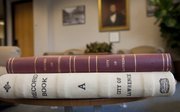 Bound copies of old Lawrence city records contain hand-written notes from City Council meetings and city ordinances dating back to the 1850s.
