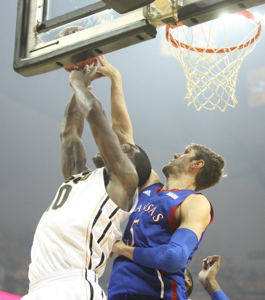 Kansas center Jeff Withey blocks a shot by Missouri forward Ricardo Ratliffe during the first half on Saturday, Feb. 4, 2012 at Mizzou Arena.