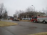 Emergency personnel respond to the scene of a bomb threat, Wednesday, Feb. 15, 2012 in Topeka, Kan. Police say a man is being questioned in Topeka after allegedly phoning in a threat against the Kansas governor's office. Capitol police spokesman Patrick Saleh says another man is being questioned Wednesday afternoon about a suspicious vehicle parked near the Statehouse. The Topeka Capital-Journal report the two events don't appear to be related.