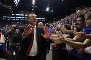 Kansas head coach Bill Self slaps hands with the fans following the Jayhawks' 87-86 overtime win over Missouri on Saturday, Feb. 25, 2012 at Allen Fieldhouse.