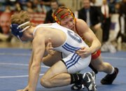Lawrence High's Hunter Haralson battles Gardner-Edgerton’s TJ Stokes in the 126-pound finals on Saturday, Feb. 25, 2012, in Wichita.