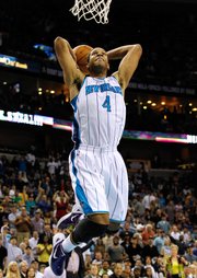 New Orleans Hornets shooting guard Xavier Henry (4) dunks the ball during the second half of an NBA basketball game against the Dallas Mavericks in New Orleans, Friday, March 2, 2012. The Hornets won 97-92.