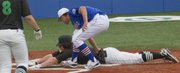 KU pitcher Jordan Luvisi attempts to put the tag on a North Dakota player at the plate Wednesday, March 7, 2012, at Hoglund Ballpark. The runner was safe, and North Dakota scored 6 runs in the top of the third inning to take an early 6-3 lead.