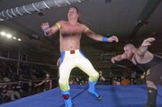 Jimmy Rockwell, left, gets tossed into the ropes by his opponent during a recent Saturday night Metro Pro Wrestling match at Turner Recreation Center in Kansas City, Kan.