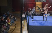The crowd watches a bout between "Showtime" Bradley Charles and "Rock ‘n’ Roll" Mike Sydal during a recent Saturday night Metro Pro Wrestling match at Turner Recreation Center in Kansas City, Kan.