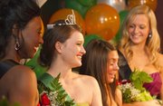 Cassie Weatherwax, second from left, and other candidates pose for photographs after Weatherwax was named the 2012 St. Patrick’s Day Parade queen during a ceremony at the Flamingo Club in North Lawrence on Sunday. Weatherwax said this would be her 12th year participating in the parade.