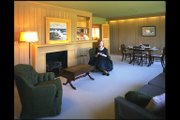 The living room in the 1950s All-Electric House is totally wired. The painting on the mantle hides a television.