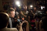 Kansas head coach Bill Self stops for questions from media members upon the team's arrival at the Embassy Suites in downtown Omaha.