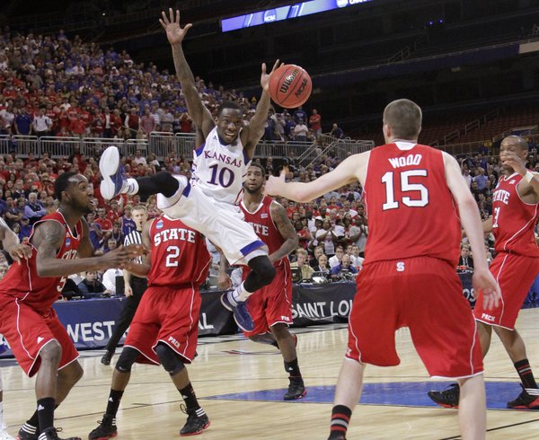 Tyshawn Taylor (10) loses the ball late in the second half of the Jayhawks' 60-57 win over North Carolina State in St. Louis Friday, March 16, 2012.