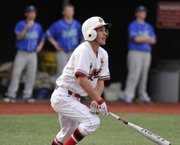 Lawrence High's CJ Stuever watches the ball after hitting a three-run homer in the third inning against Blue Springs South Tuesday, March 27, 2012.