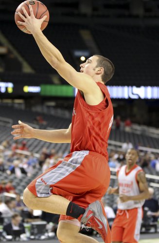 Ohio State guard Aaron Craft goes up for a layup during a day of practices at the Superdome on Friday, March 30, 2012.