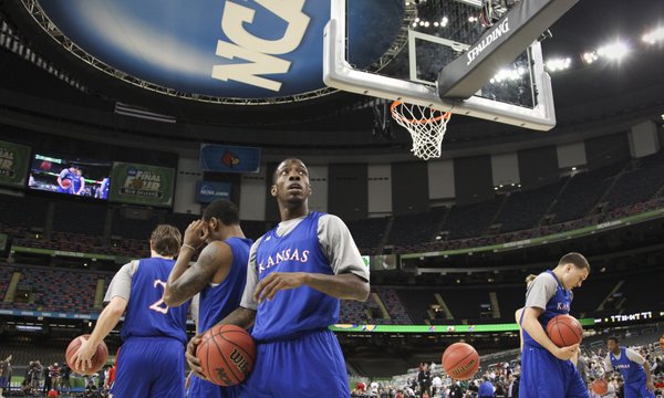Kansas guard Tyshawn Taylor scans around the Superdome as the Jayhawks take the court for practice on Friday, March 30, 2012.