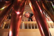 Bill Klimas, a Reuter Organ employee, adjusts organ pipes March 31 at First Presbyterian Church, 2415 Clinton Parkway. The church spent seven years repairing and updating its organ, and will be unveiled for the first time Easter Sunday.