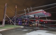Downed power lines kept some people trapped in a Quiktrip at Rock and Pawnee in Wichita, Kansas after a tornado swept through the area Saturday night April 14, 2012. Tornadoes were spotted across the Midwest and Plains on Saturday as an outbreak of unusually strong weather seized the region, and forecasters sternly warned that "life-threatening" weather could intensify overnight.