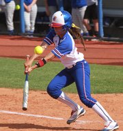 Kansas' Elsa Moyer slaps a single in the Jayhawks' first game of a doubleheader with UMKC on Wednesday, April 25, 2012, at Arrocha Ballpark.