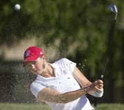 Kansas University golfer Meghan Potee takes a turn from a sand trap during a practice round for the Big 12 Championships on Thursday, April 26, 2012 at Lawrence Country Club.