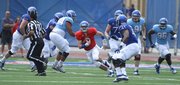 Kansas redshirt quarterback Jake Heaps takes off on a run during the first half of the Spring Game on Saturday, April 28, 2012 at Kivisto Field.